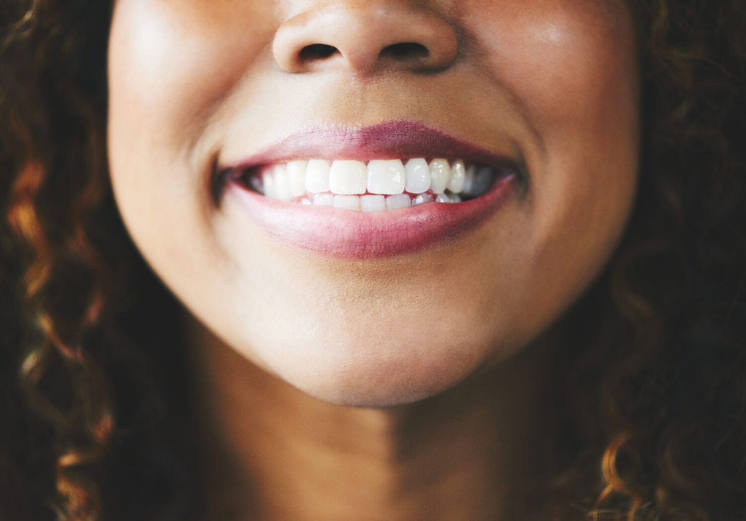 Young woman showing healthy gums